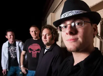 band photo with bassist in focus