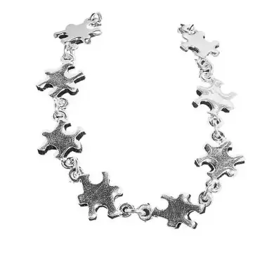 A bracelet made of metal puzzle pieces for autism awareness